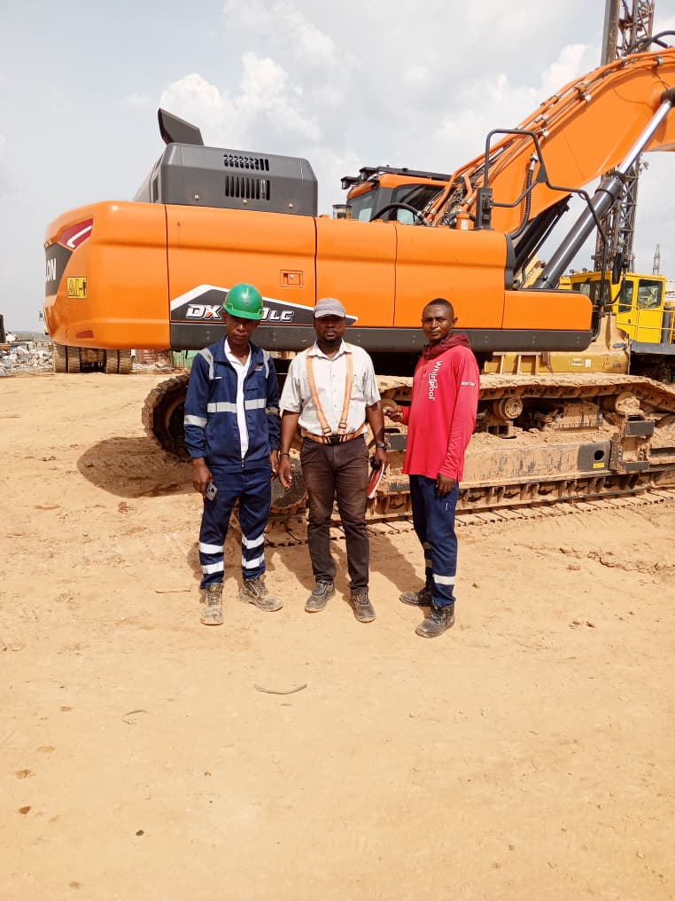 Technical team inspecting heavy equipment